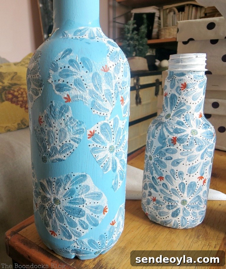 Adding flower shapes from the napkins to plastic bottles.