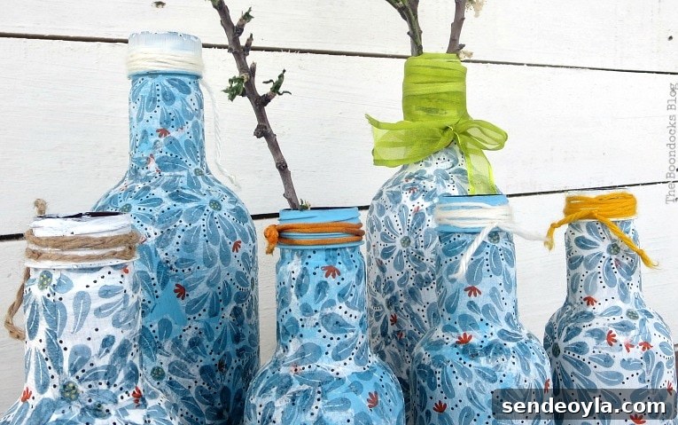 ribbons, yarn and cords added as embellishment to finished decoupaged bottles.