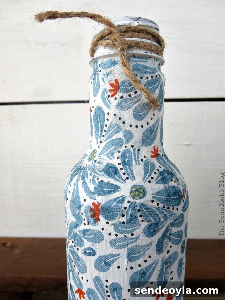 White decoupaged bottle.