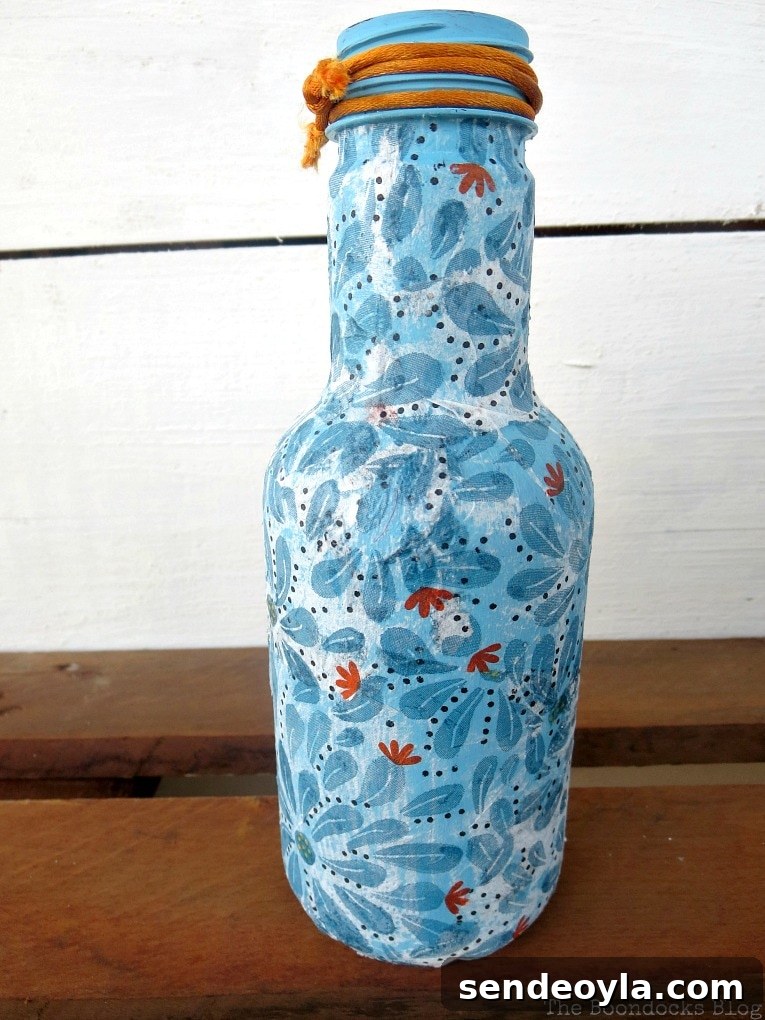 Blue decoupaged bottle.