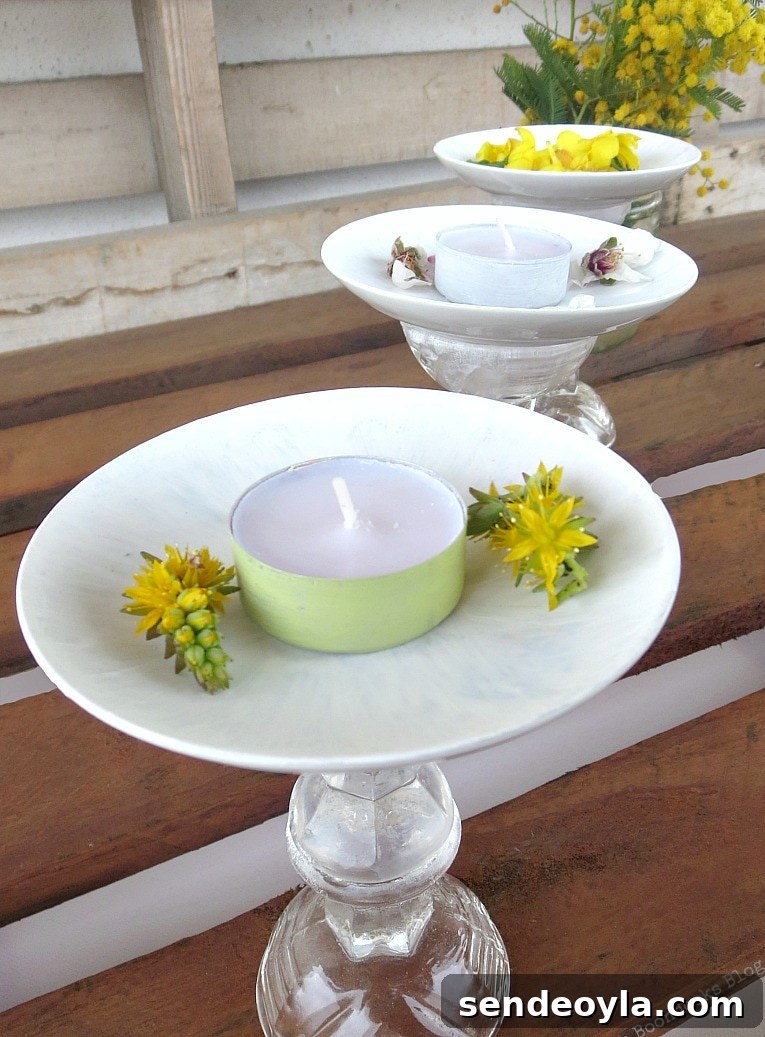 DIY Spring Pedestal from Upcycled Cordial Glasses and Saucers 2 Tops of saucers with flowers and tealights.