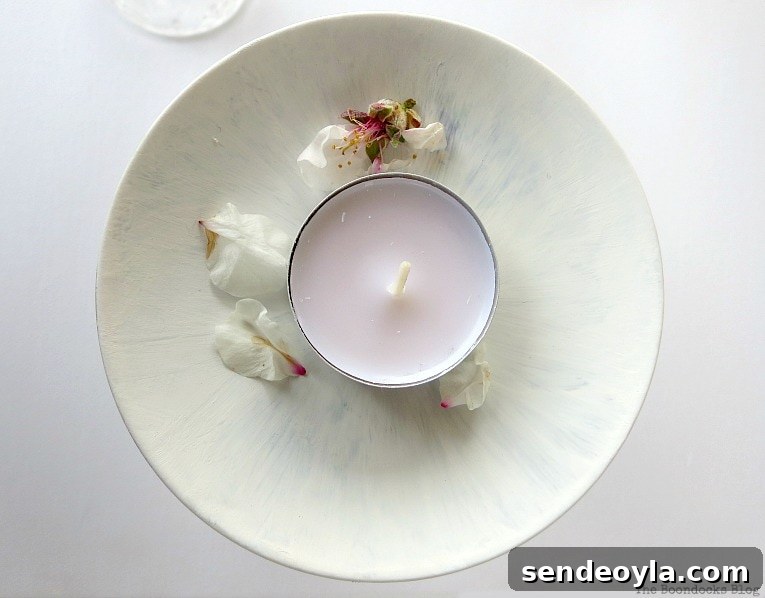 DIY Spring Pedestal from Upcycled Cordial Glasses and Saucers 11 Almond flowers and a tealight sitting on the painted saucer.