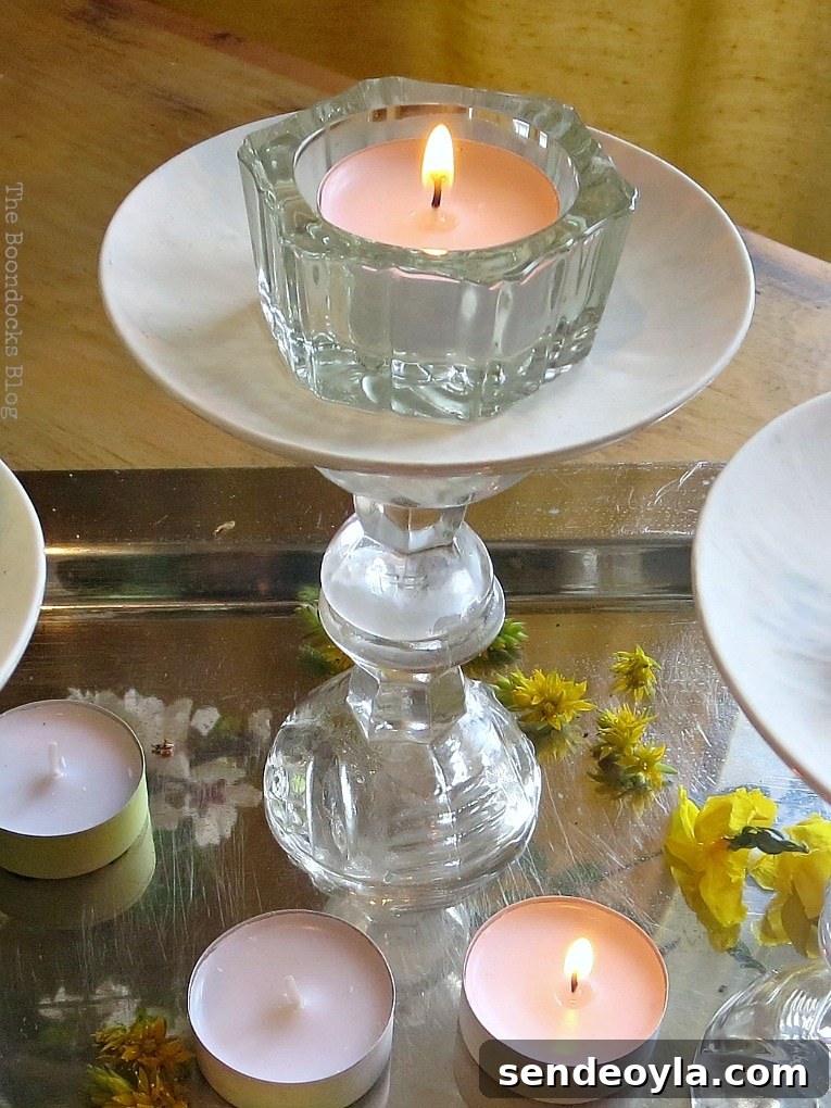 DIY Spring Pedestal from Upcycled Cordial Glasses and Saucers 17 Lighting the tealights on and around the pedestal.
