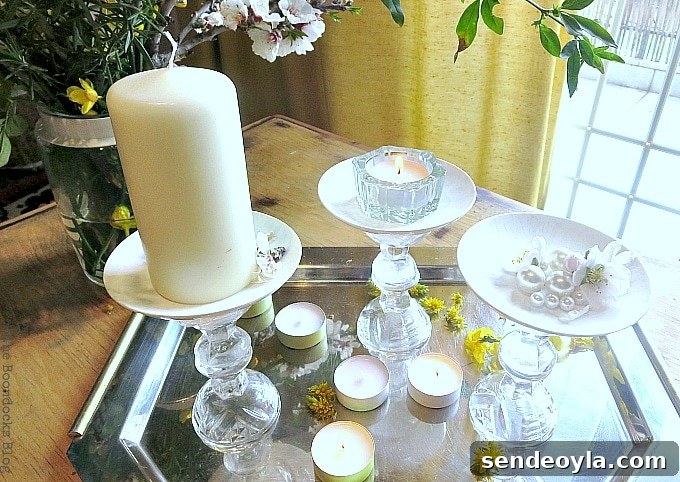 DIY Spring Pedestal from Upcycled Cordial Glasses and Saucers 18 Silver tray with cordial glass pedestals, candles and flowers.