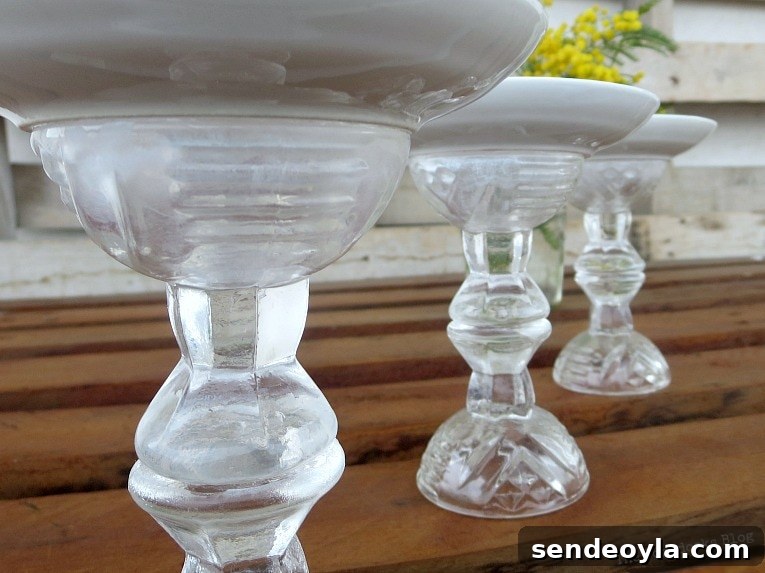 DIY Spring Pedestal from Upcycled Cordial Glasses and Saucers 10 Angled view of the cordial glasses glued together to make a pedestal.