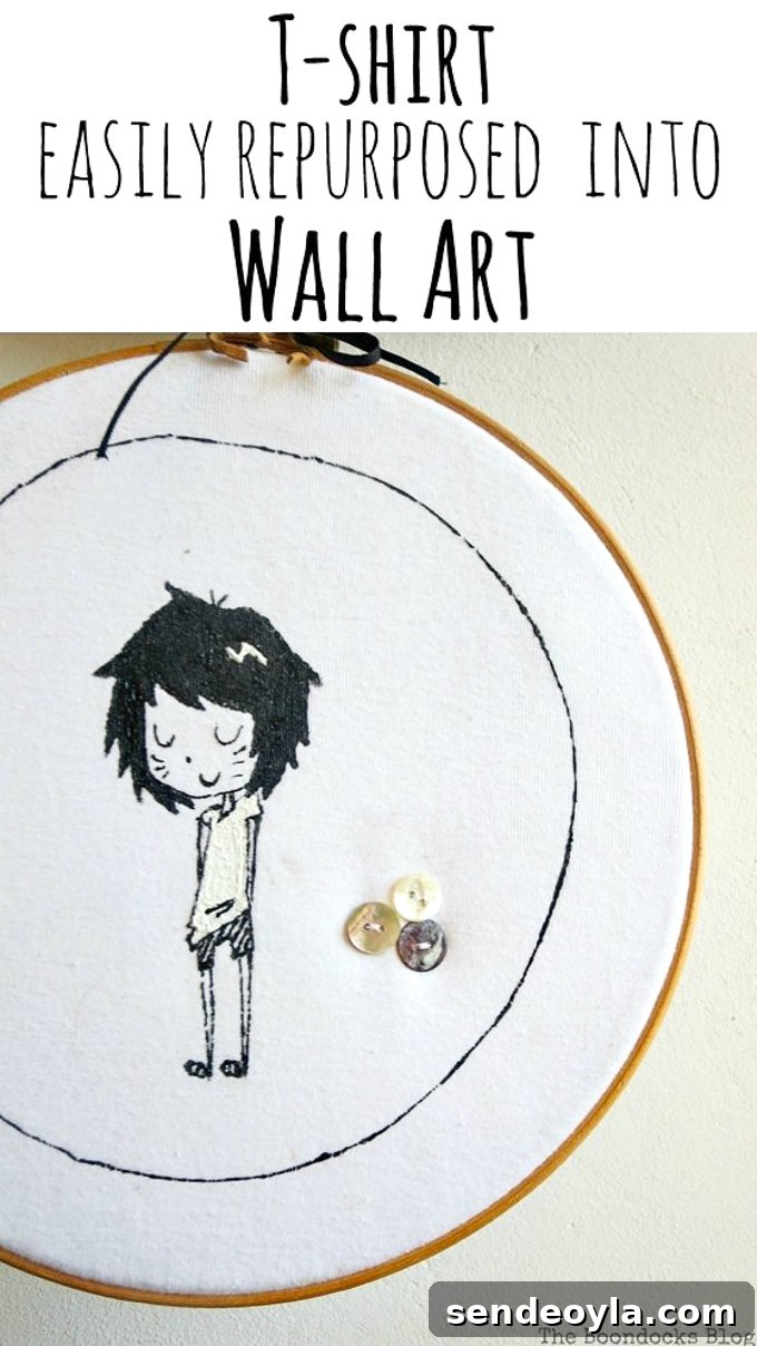 DIY T-Shirt Wall Art: Transform a Tee into Home Decor 12 Close up of hoop wall art made from an upcycled tshirt. It shows a girl character and three sewn on buttons and text overlay "T-shirt easily repurposed into wall art"