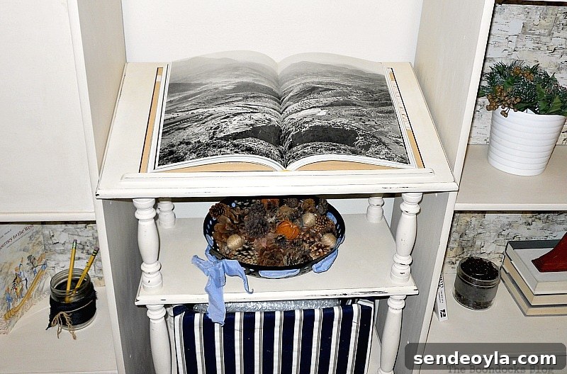 Transform Bookcases with Paint and Wrapping Paper 11 Book on a dictionary stand and fabric covered storage underneath.