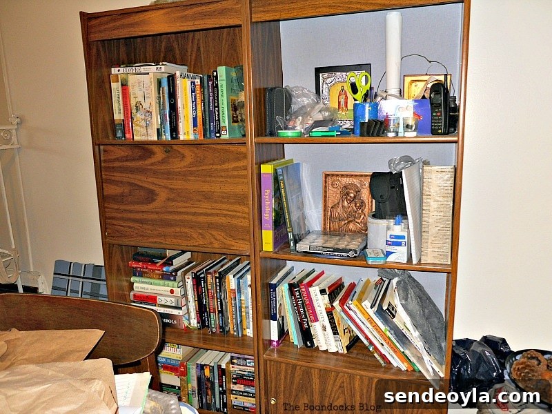 Transform Bookcases with Paint and Wrapping Paper 13 Brown book shelves decorated with. books.