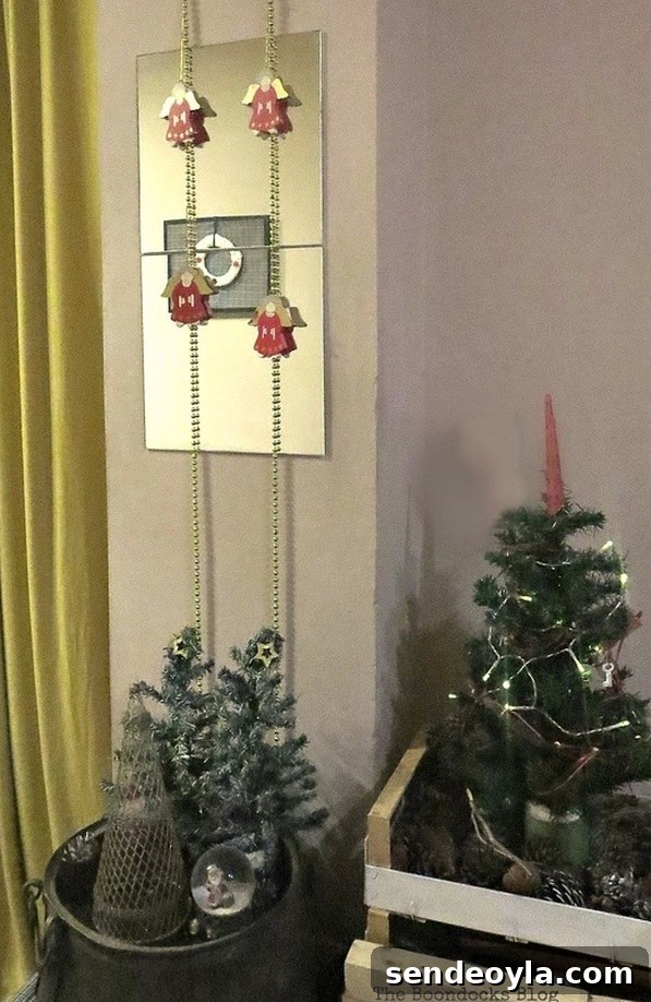 gold garland hung with wooden angels, How to Repurpose your Decor for a Unique Christmas Look
