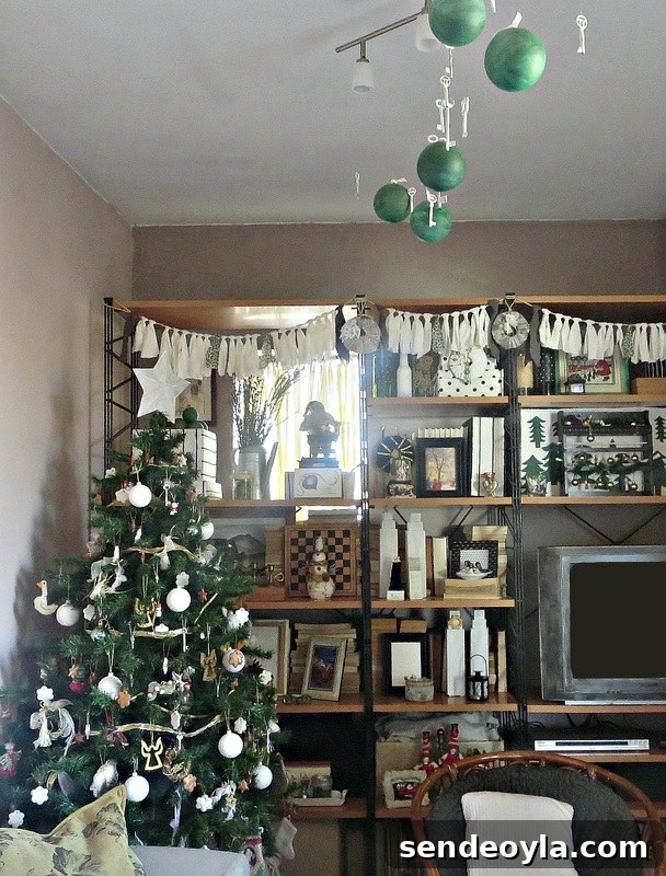 lomg view of living room and wall unit, How to Repurpose your Decor for a Unique Christmas Look