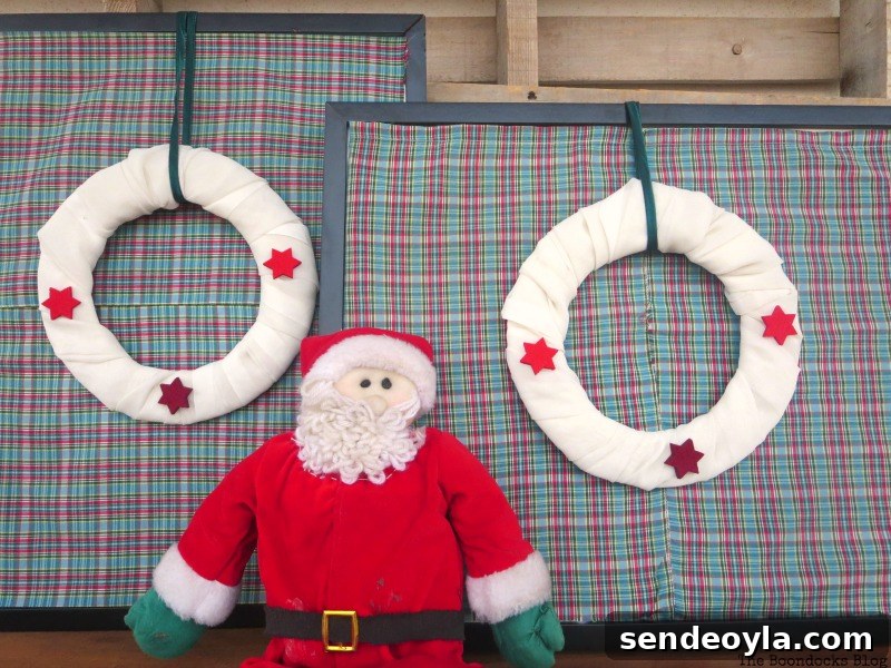 Finished wreaths and frames with Santa, Christmas Picture Frames with Wreaths the Lazy Way www.theboondocksblog.com