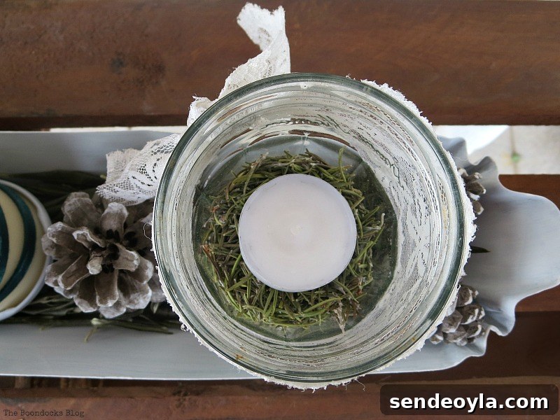 Green Christmas Centerpiece Ideas to Wrap Up the Holidays 12 Overhead shot of jar with tealight, Easy Green Christmas Centerpieces
