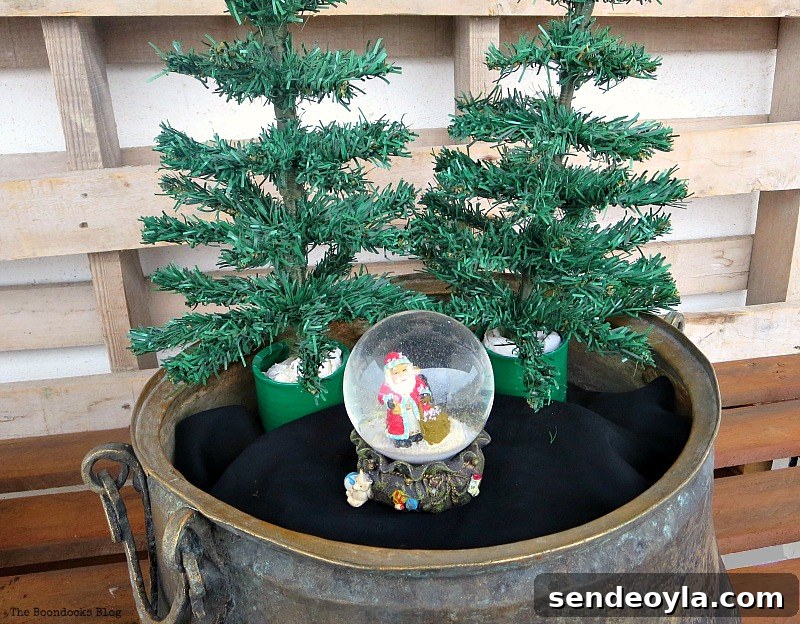 Adding trees and a snow globe, A repurposed Antique Cauldron for Christmas theboondocksblog