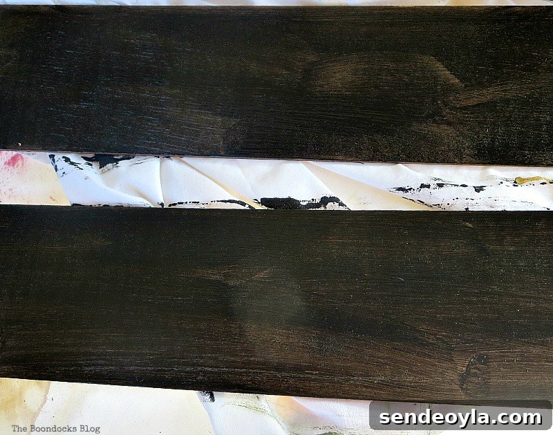 Painting the wood with chalkboard paint, Easy Chalkboard signs for the Holidays www.theboondocksblog.com