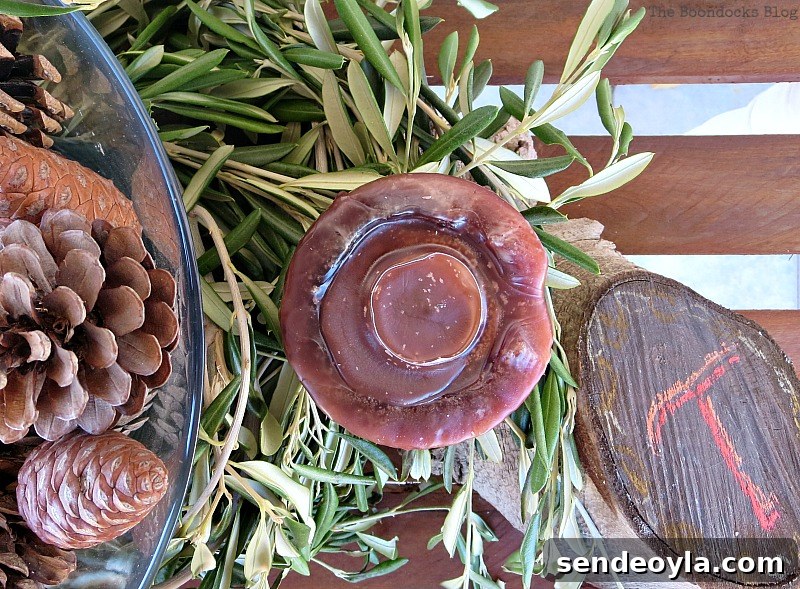 DIY Natural Thanksgiving Table Centerpiece Ideas 15 Closeup of candle and wood stump with T chalked on.