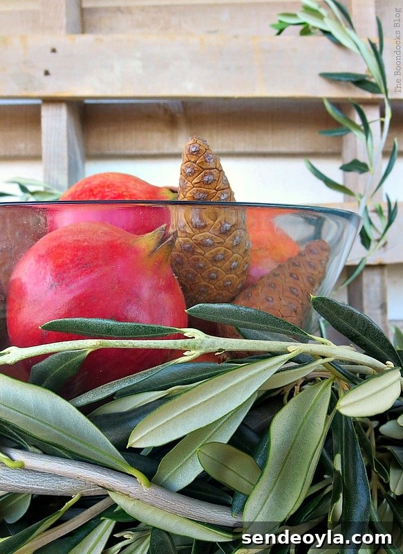 DIY Natural Thanksgiving Table Centerpiece Ideas 19 Centerpiece with pomegranates, pine cones and olive branches