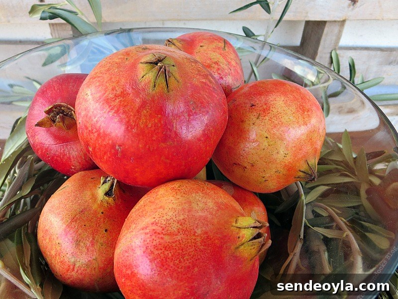 DIY Natural Thanksgiving Table Centerpiece Ideas 7 Pomegranates in a glass bowl.