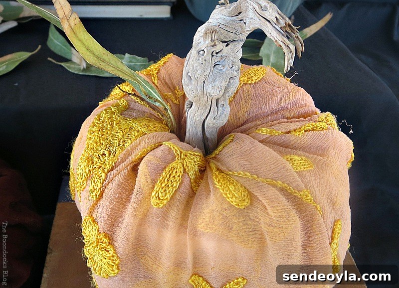 Scarf wrapped toilet paper pumpkin