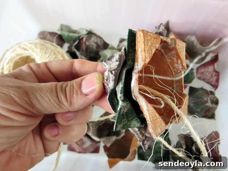 Threading the twine, How to Make Easy Fall Flowers using Egg Cartons