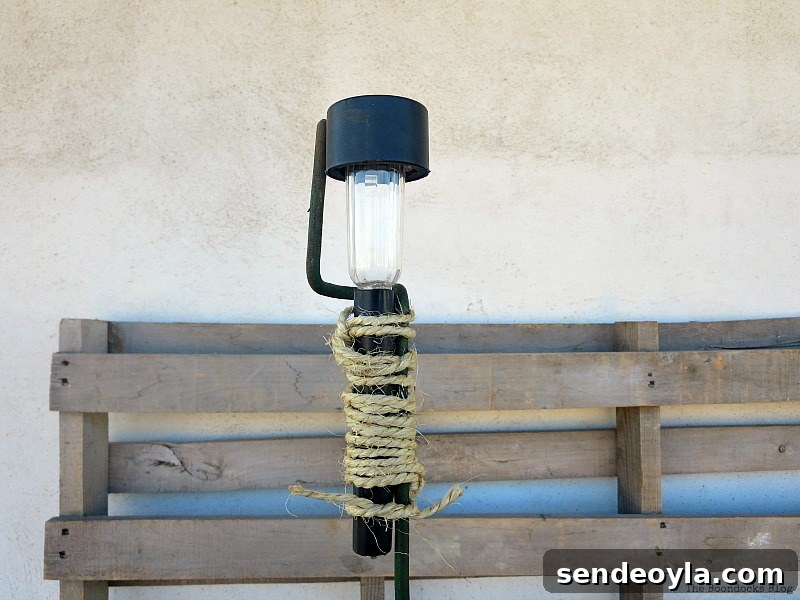 Securing the solar light with twine