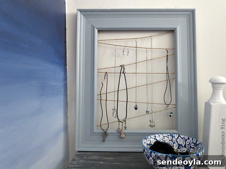 DIY Earring Organizer Ideas to Declutter Your Jewelry 18 Upcycled frame jewelry organizer.