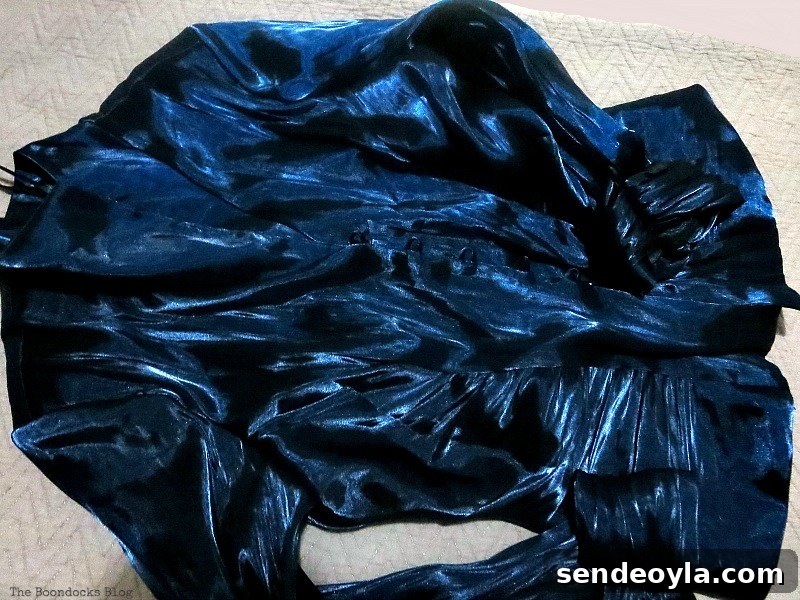 DIY Earring Organizer Ideas to Declutter Your Jewelry 6 A blue satin blouse.