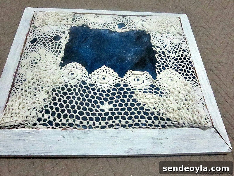DIY Earring Organizer Ideas to Declutter Your Jewelry 9 Placing the covered cardboard in the frame.