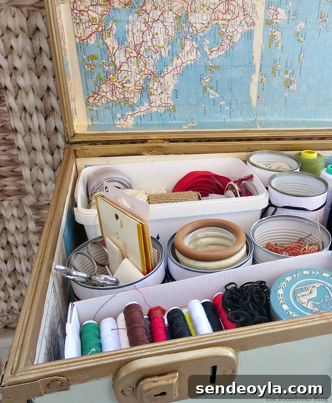 Tins cans full of storage supplies, What's Inside the Vintage Suitcase? www.theboondocksblog.com