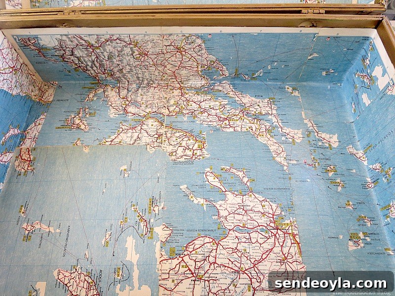 Decoupaging a map on the inside, What's Inside the Vintage Suitcase? www.theboondocksblog.com
