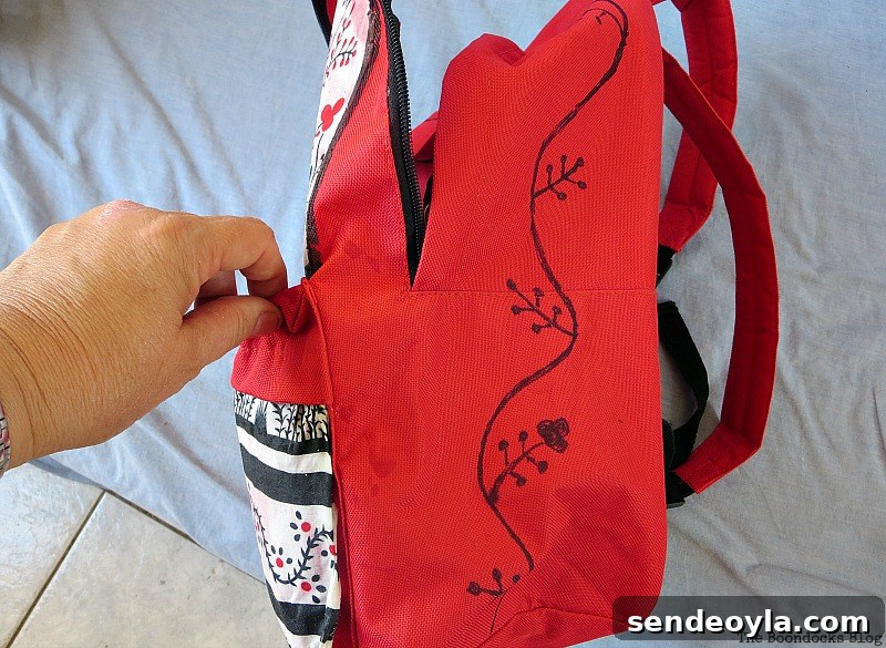 DIY Upcycled Backpack from Old Clothes 11 Hand-drawn floral detail on side