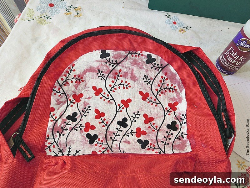 DIY Upcycled Backpack from Old Clothes 8 Gluing fabric onto backpack