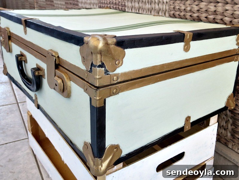 Transform a Vintage Suitcase into Chic Home Storage 13 Corner view of the painted vintage suitcase.