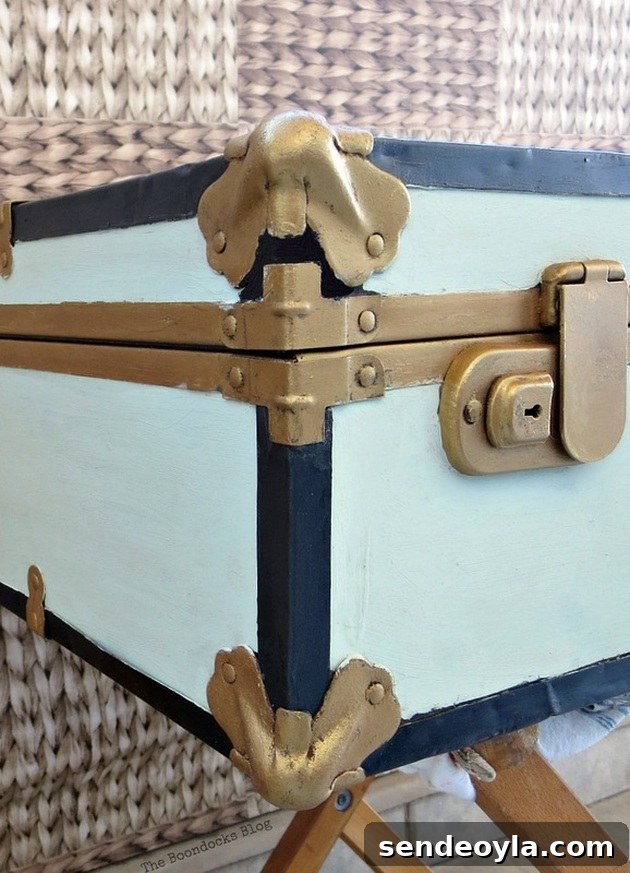 Transform a Vintage Suitcase into Chic Home Storage 16 Close up of the gold painted corner bumps.