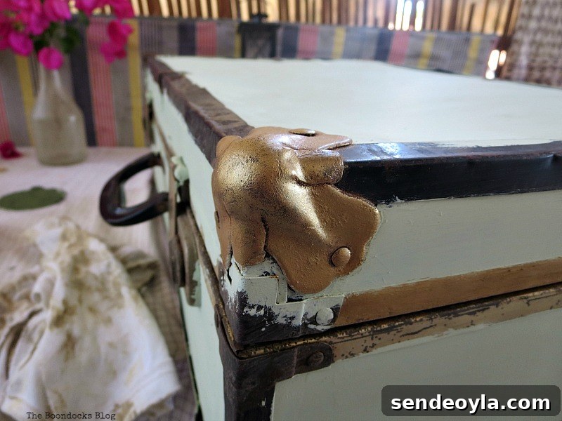 Transform a Vintage Suitcase into Chic Home Storage 5 Painted the brass corner bumpers in gold.