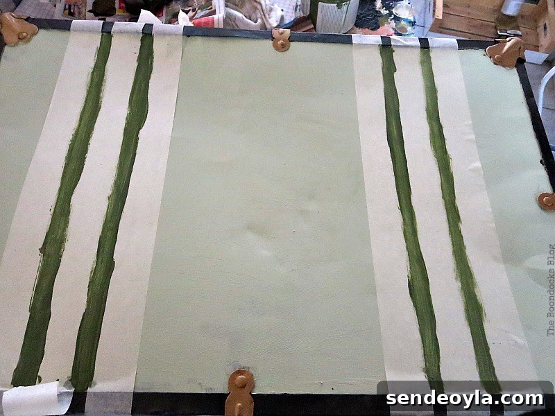 Transform a Vintage Suitcase into Chic Home Storage 9 Painting green stripes on top of suitcase to look like straps.