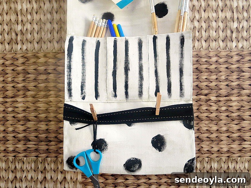 DIY Hanging Organizer for Back-to-School Supplies 13 The pockets holding an assortment of pens, pencils and brushes, How to make a back to school hanging organizer, Back to School blog Hop www.theboondocksblog.com