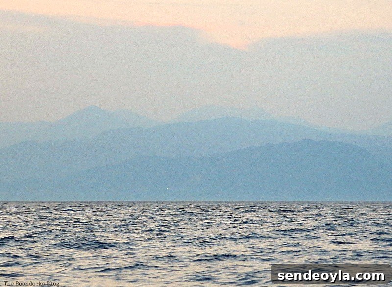 Layers of mountain silhouettes, A Boat Ride into the Sunset www.theboondocksblog.com