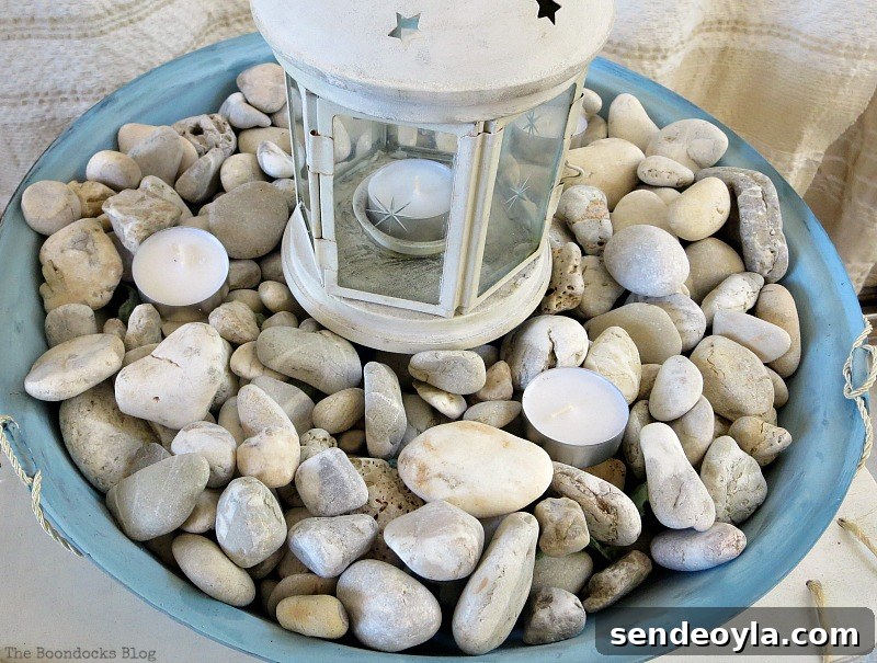 Upcycle a Grill into a Nautical Lantern 11 Placing tealights on top of pebbles, How to make a Nautical Lantern from a Grill - Int'l Bloggers Club Challenge www.theboondocksblog.com