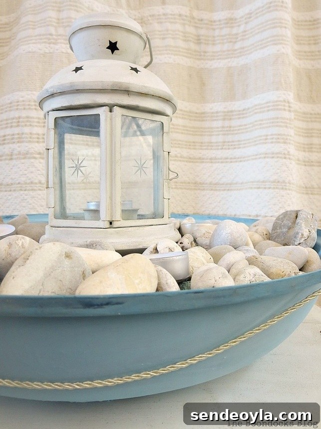 Upcycle a Grill into a Nautical Lantern 18 Lantern on top of pebbles with tealights in a grill cover, How to make a Nautical Lantern from a Grill - Int'l Bloggers Club Challenge www.theboondocksblog.com