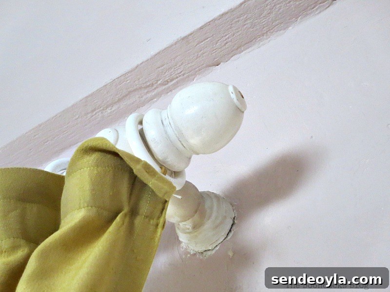 Curtain rod bracket above sliding door