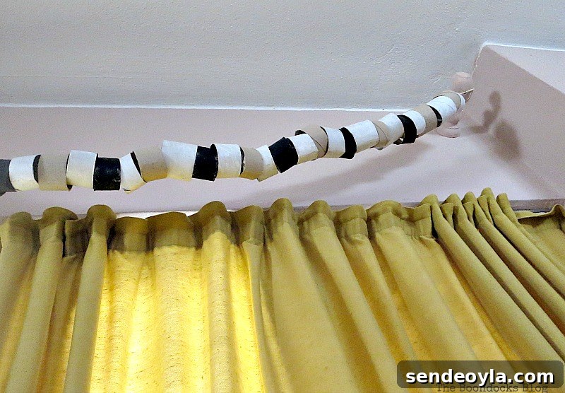 Garland hanging from curtain brackets