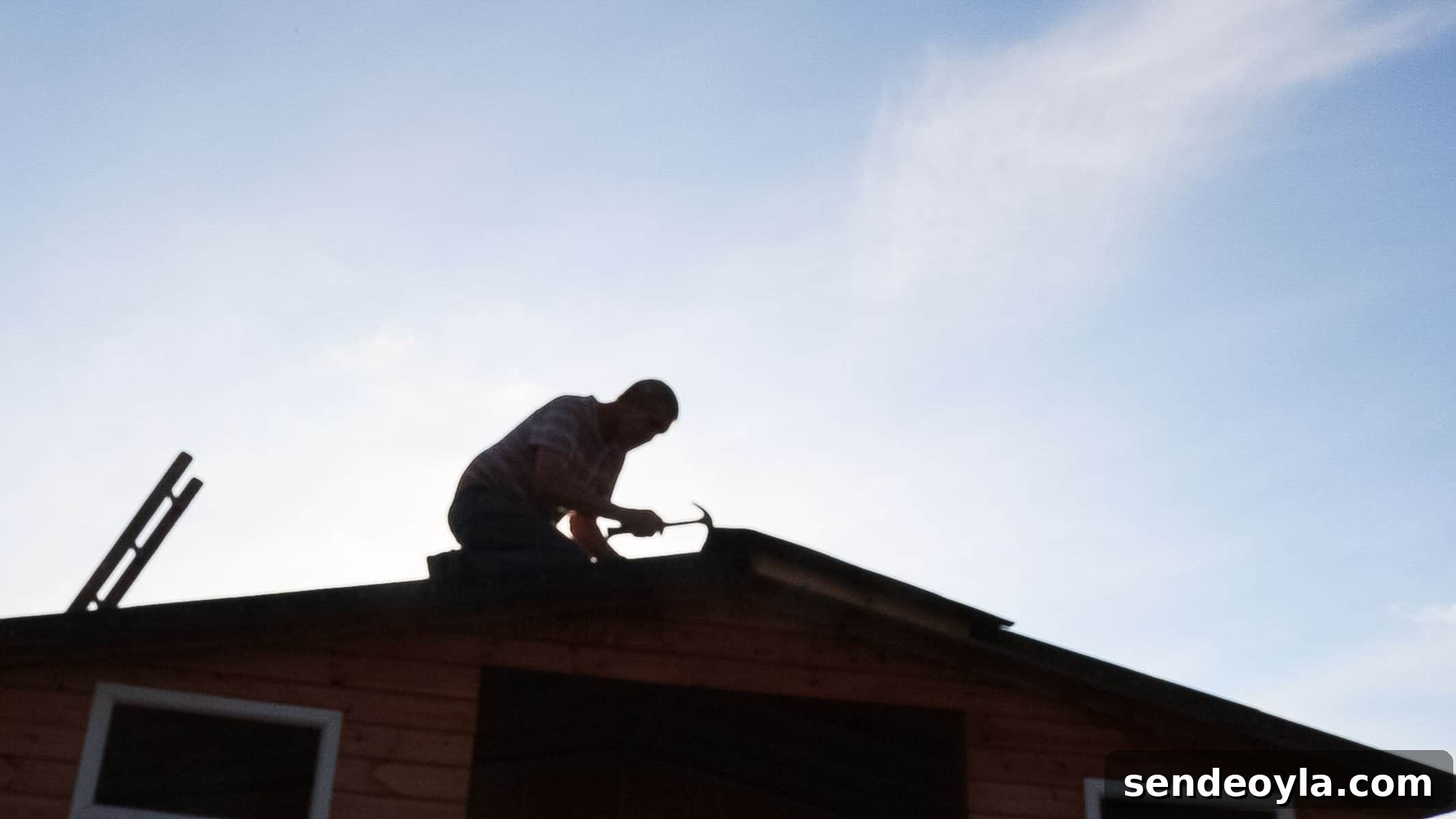 Install Roofing Felt on a Shed: Step-by-Step Tips 14 Carpenter on a shed roof installing last section of shed felt