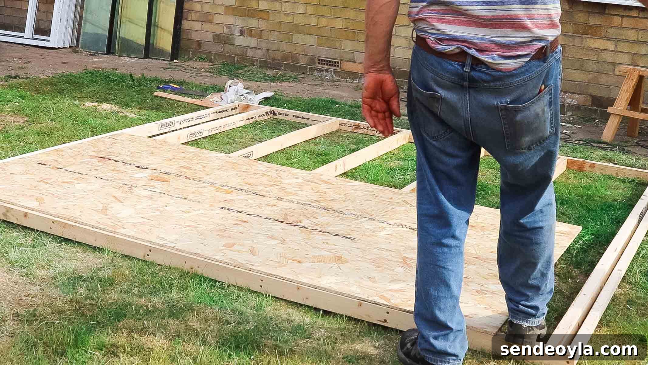 Install Roofing Felt on a Shed: Step-by-Step Tips 5 laying OSB sheet wood on roof framing
