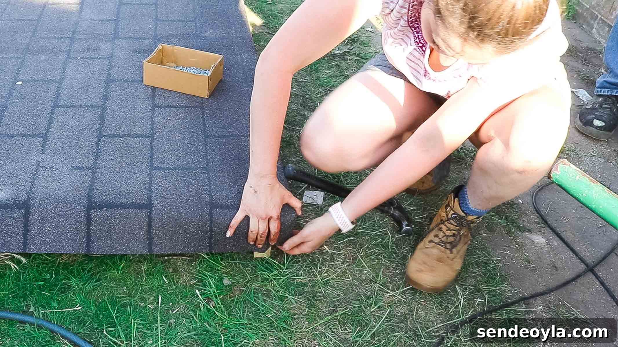 Install Roofing Felt on a Shed: Step-by-Step Tips 9 woman doing a blanket fold with shed roof felt on corners before nailing