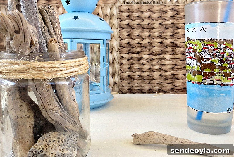 Milk Crate Table Upcycle: Stylish DIY Makeover 13 Close up of table top items, including a blue lantern, a drinking cup and driftwood in a jar.