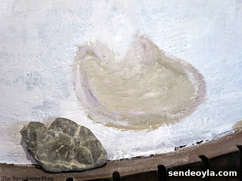 Long-Overdue Fireplace Makeover: Inspiring Before and After 4 Painting the stones on the fireplace, The Long Overdue Fireplace makeover www.theboondocksblog.com