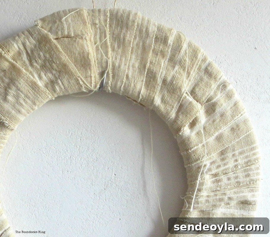 Wrapping the cardboard with fabric strips