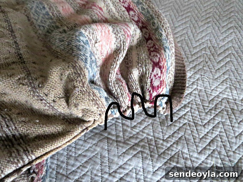 DIY Sweater Pillow Tutorial: Upcycle Old Sweaters 9 gathering the ends of sweaer, sweater pillows the easy way - www.theboondocksblog.com