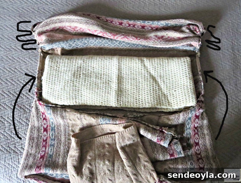 DIY Sweater Pillow Tutorial: Upcycle Old Sweaters 10 Adding fillig and folding sweater, Sweater pillow the easy way - www.theboondocksblog.com