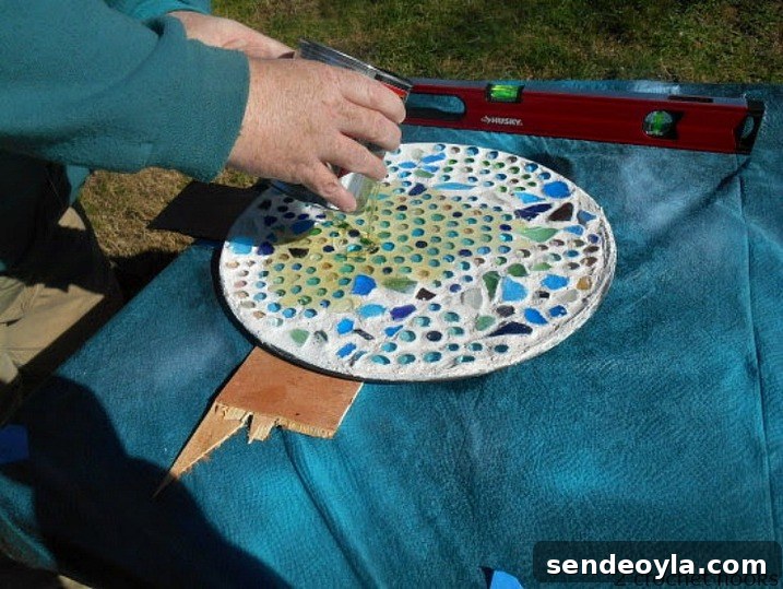 Adding polyurethane to the top of the table top.